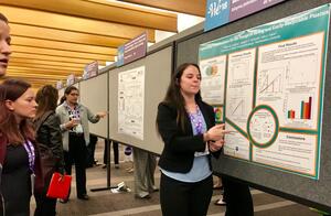 Alayna Johnson presenting a research poster