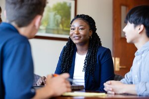 Students talking around a table