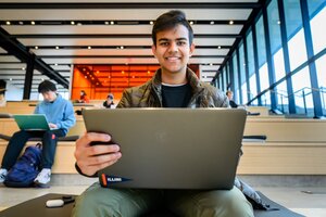 Students study on the monumental study steps area at the Campus Instructional Facility CIF